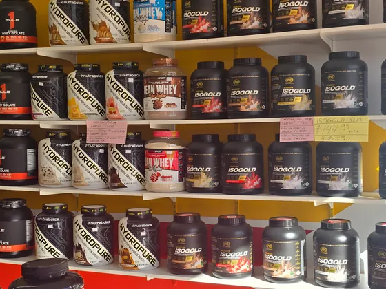 Supplement shelves with prices at Muscle Depot
